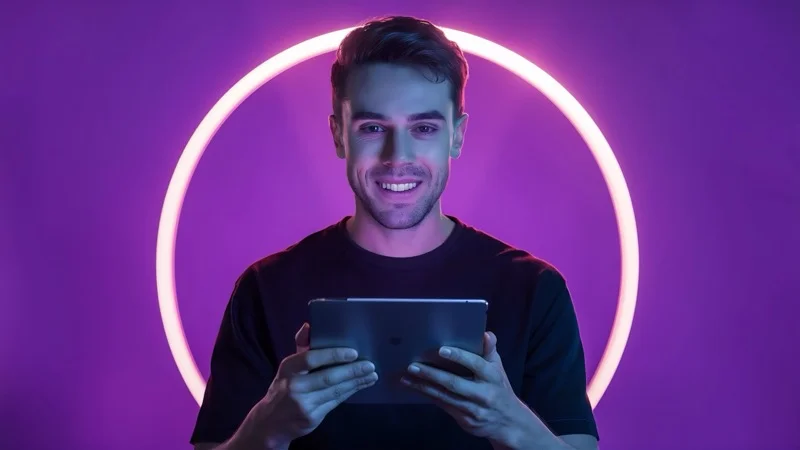 Happy gamer winning tablet game